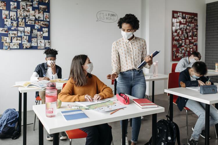 Teacher engaging with student