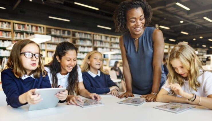 Teaching Assistant engaging with students in the classroom