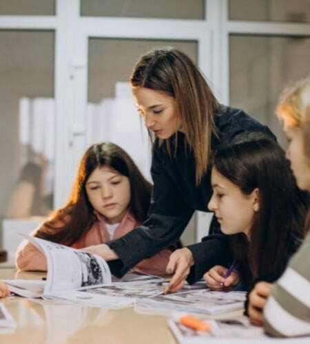 Teacher guiding students